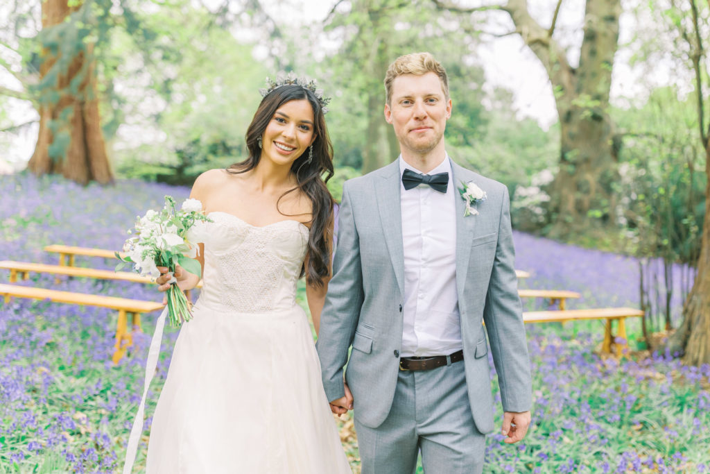 Bride & Groom in bluebell fields wedding ceremony. Tips to plan a ligt and airy wedding